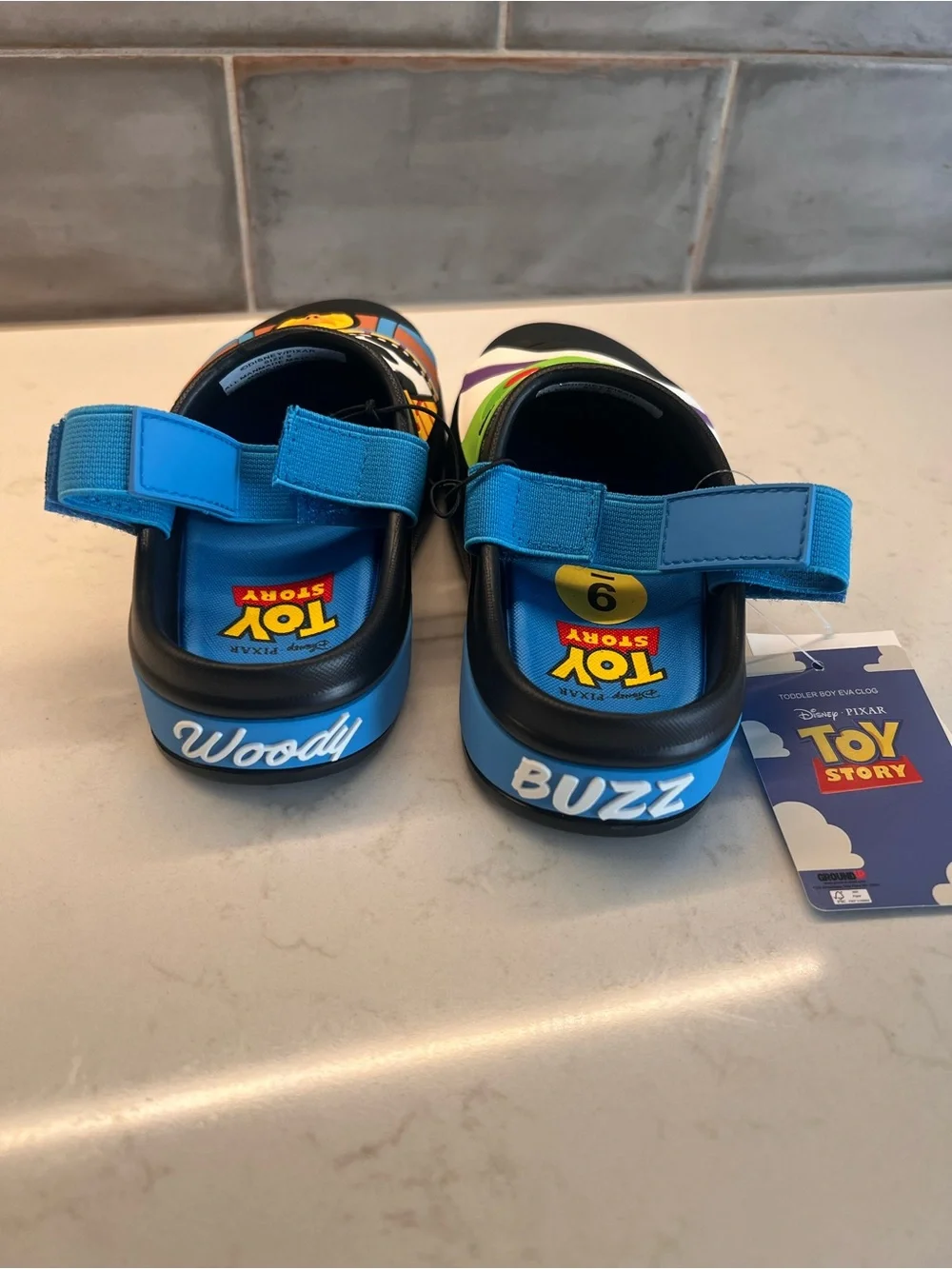 Kids Black Toy Story Slip-On Clogs with Blue Strap